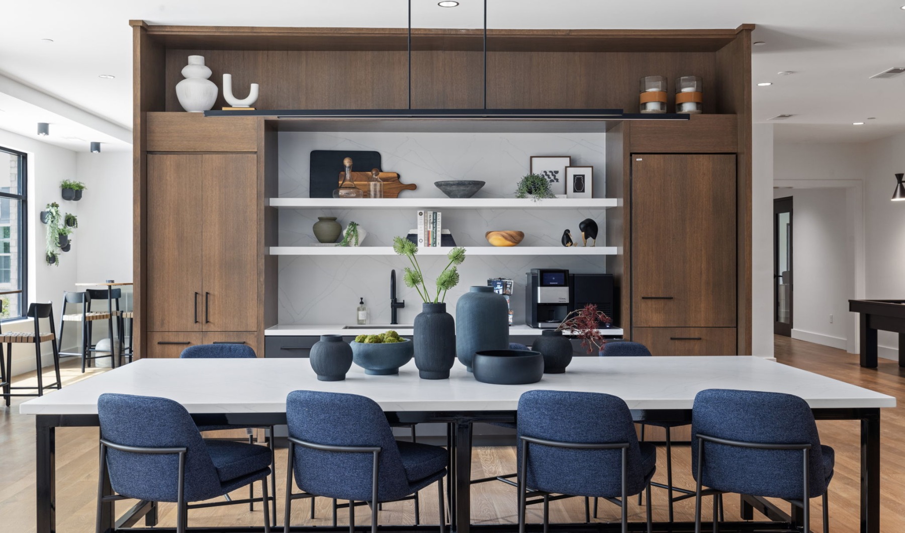 open clubhouse kitchen with a table and chairs