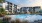 lounge chairs and picnic tables around outdoor pool